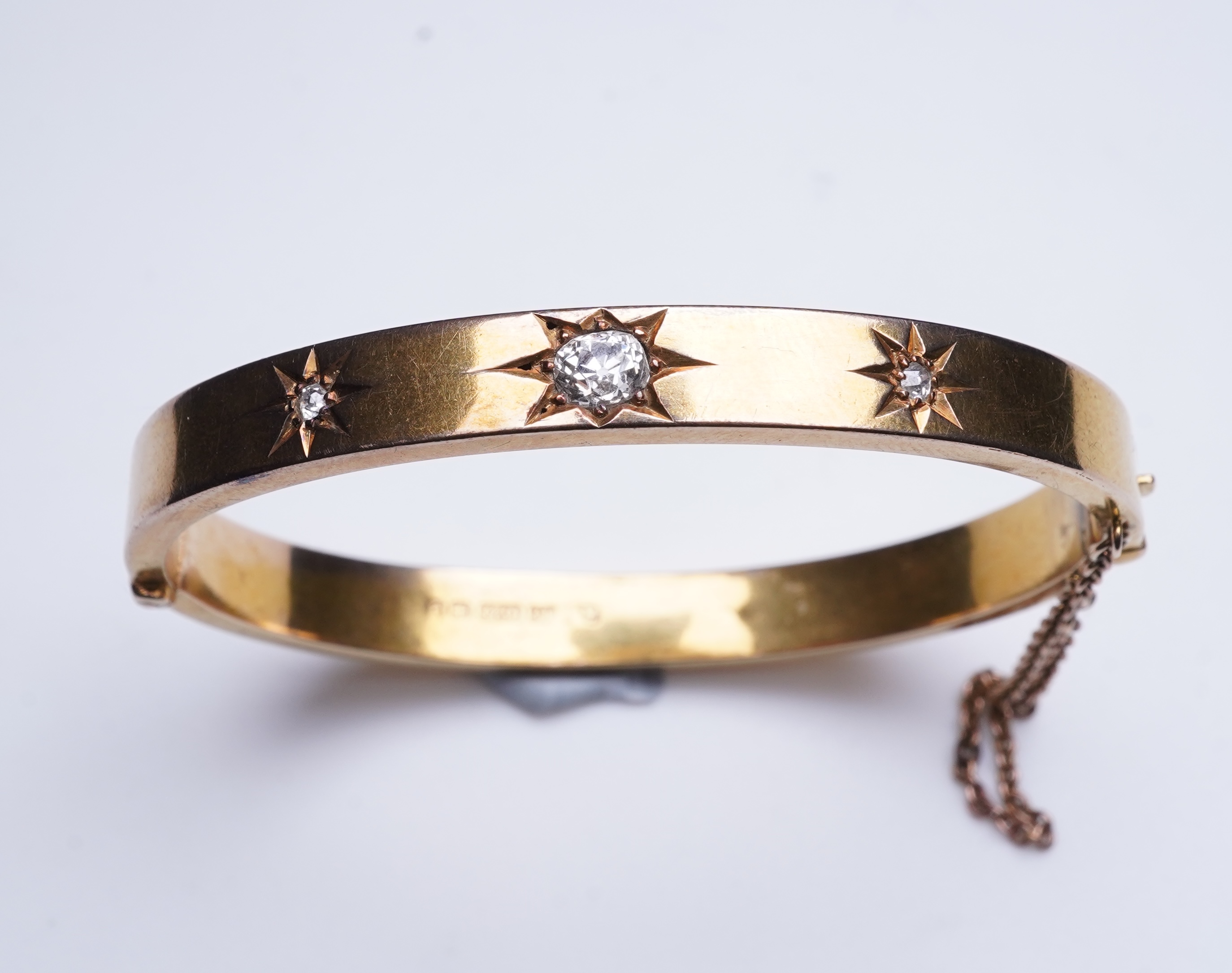 An Edwardian 15ct gold and diamond bangle, circa 1904